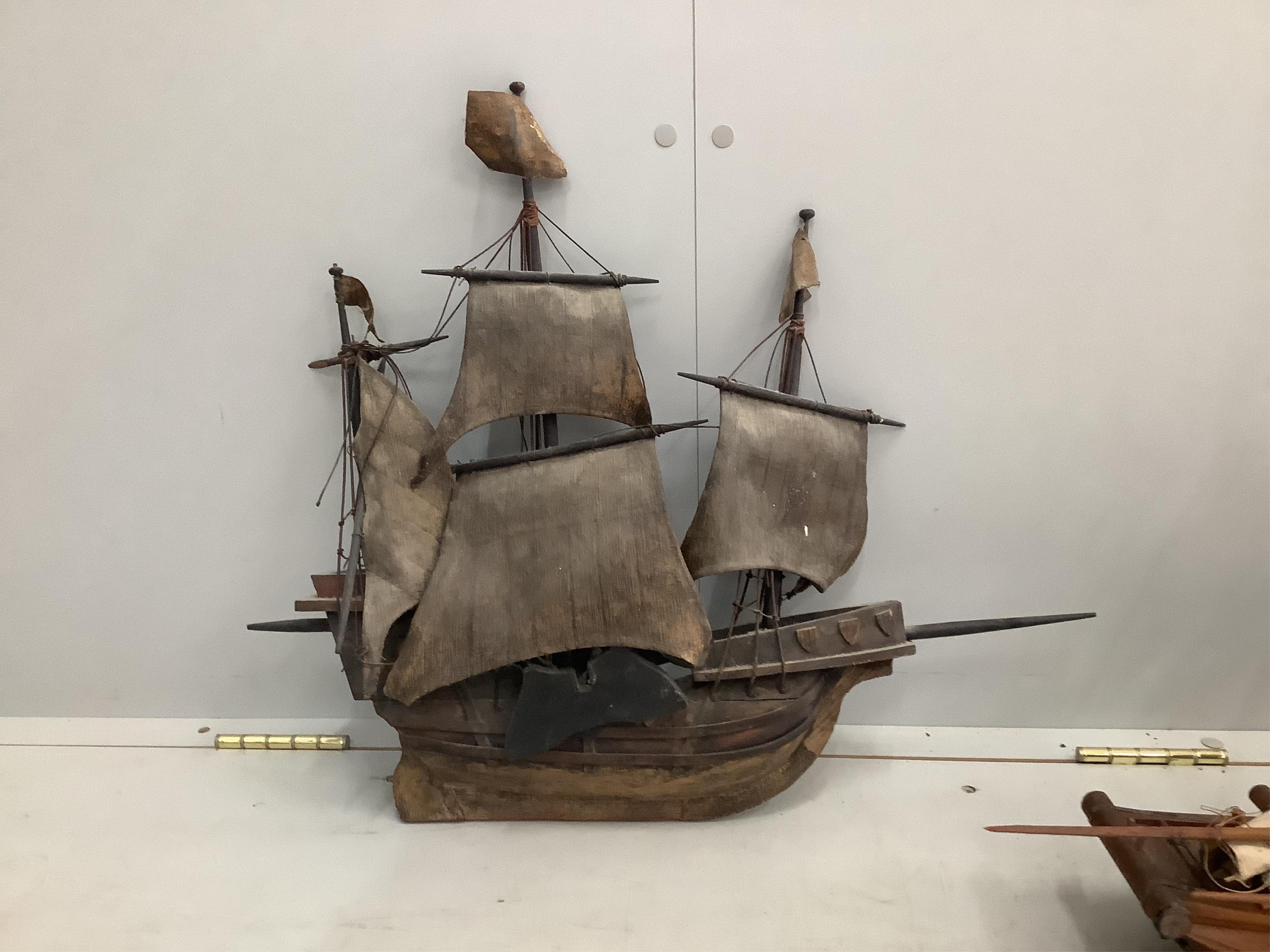 Two wooden model boats, larger length 67cm. Condition - poor